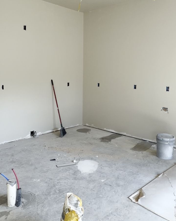 Inside the real Aurora Duplex under construction, with drywall up in the open kitchen area
