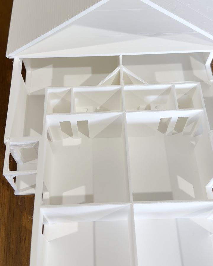 The Aurora Duplex model with its roof lifted, showing every room inside